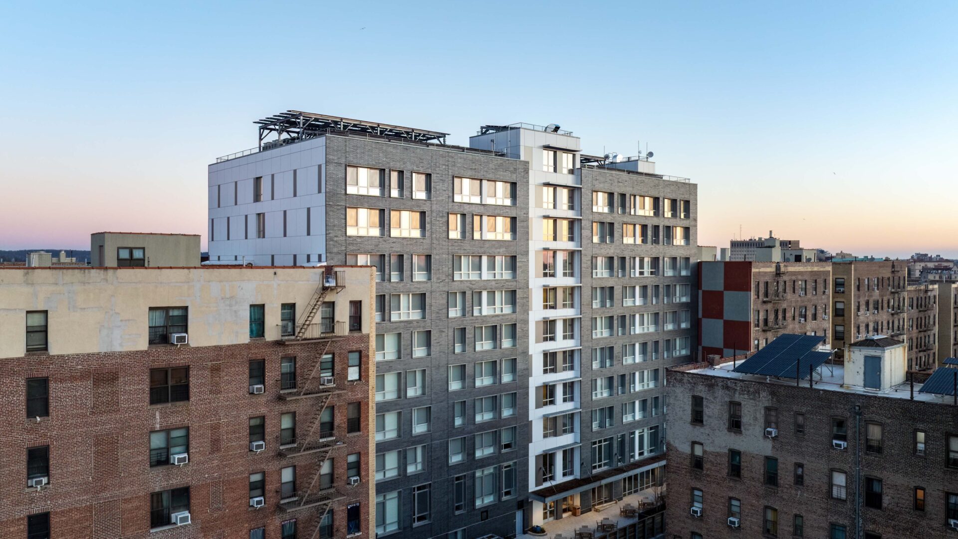 An outside shot of YP Senior Residence, a 9-story rental building.