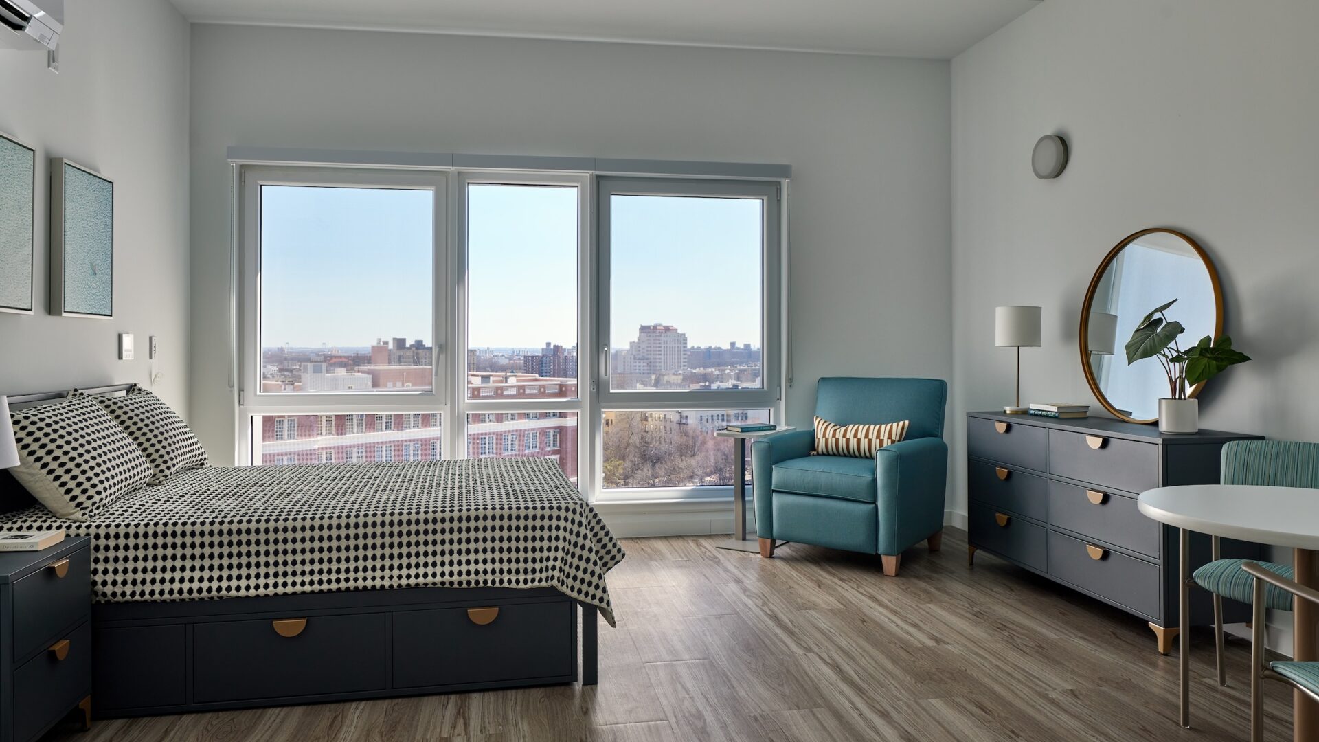 A clean, contemporary bedroom overlooking the city