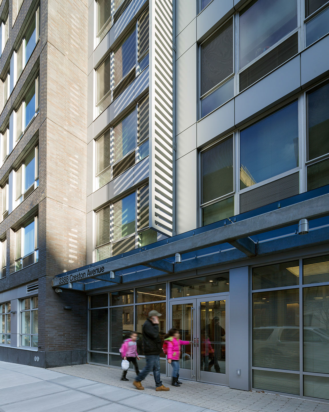 Family entering building