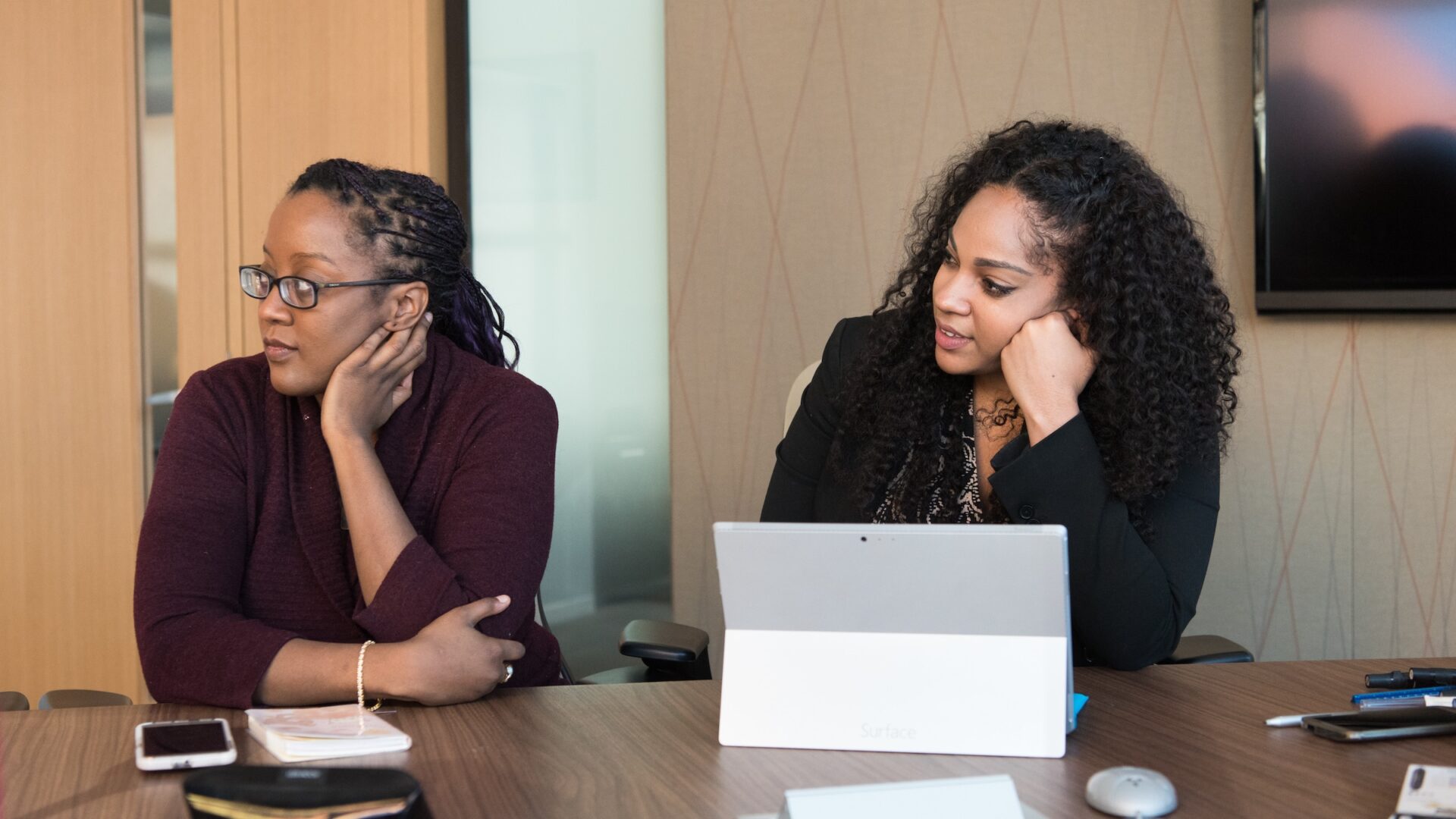 Two young women at a resume workshop