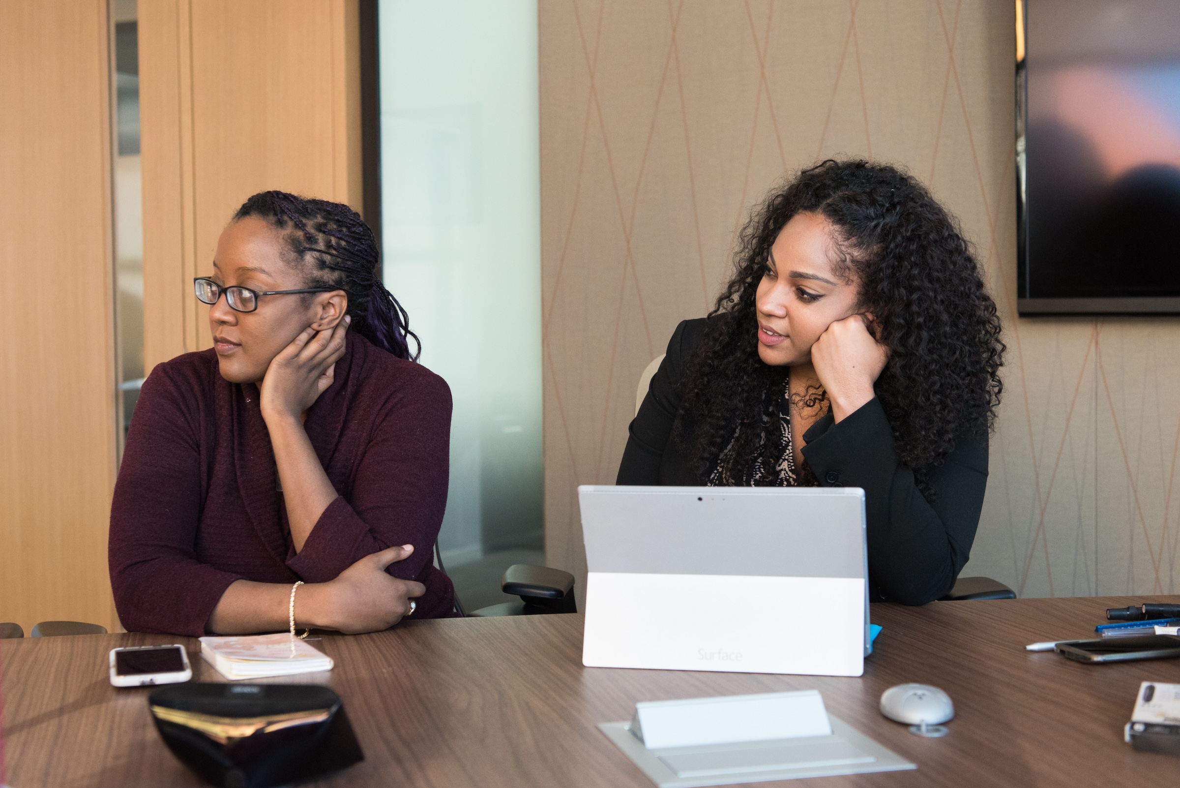 Two young women at a resume workshop