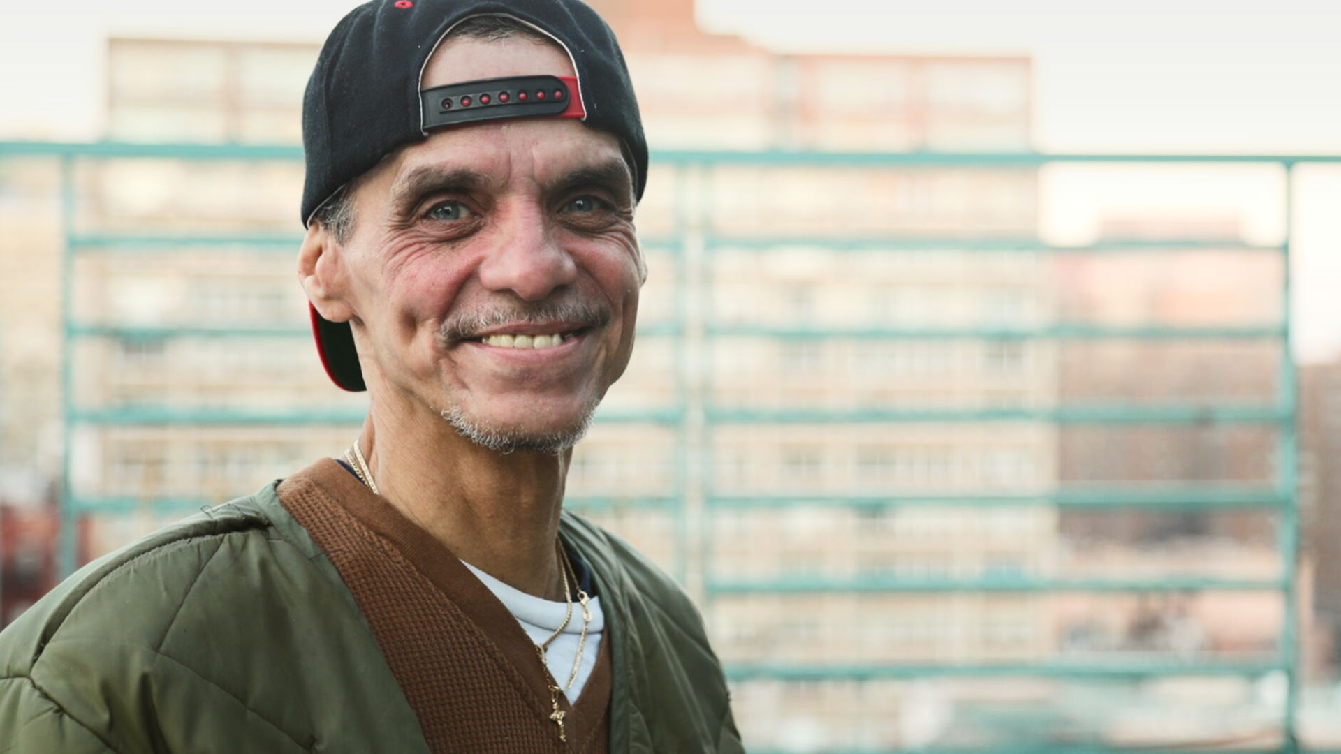 Image of man in front of a building