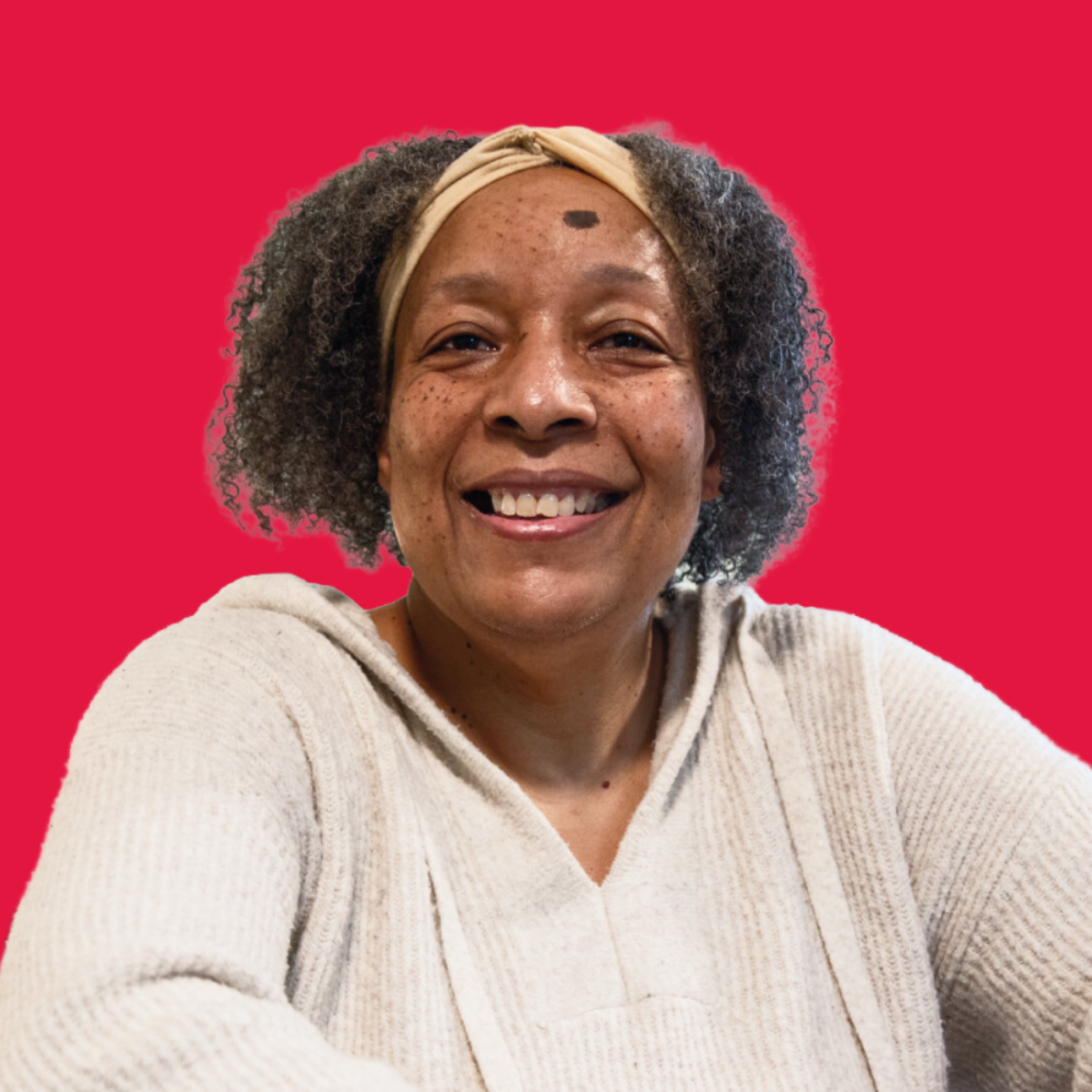 Portrait of a person against a red background
