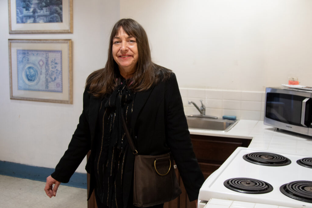 Lenore in her shared kitchen at East 12th Street Residence. Photo by Yvonne Marquez