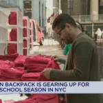 A still of a PIX11 broadcast covering Operation Backpack at New York Stock Exchange.